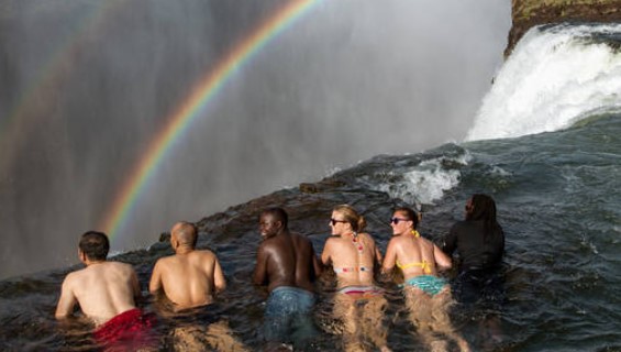 Swimming in the Devil's pool on the edge of the Victoria Falls