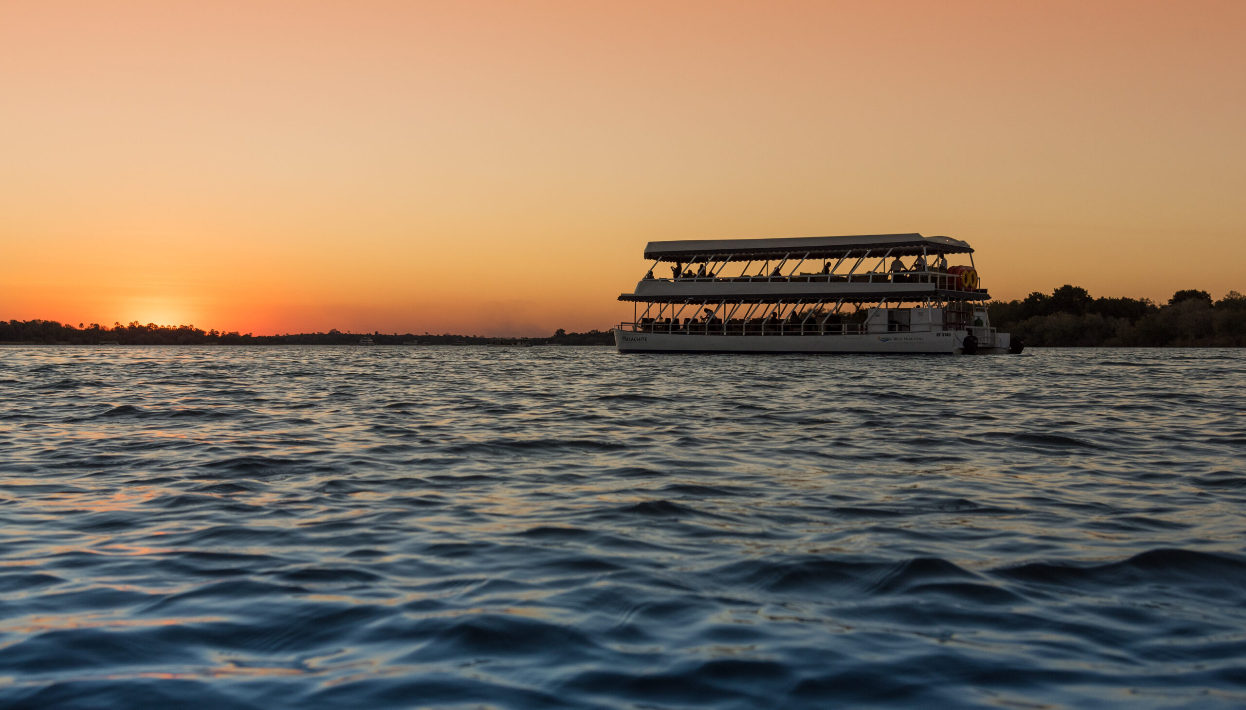 Malachite Sunset cruise with dinner on the Zambezi River in Victoria Falls, Zimbabwe