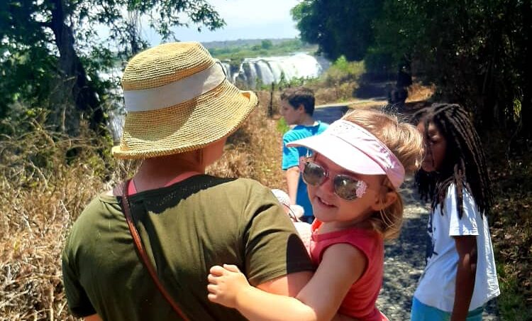 Family touring the Victoria Falls in Zimbabwe